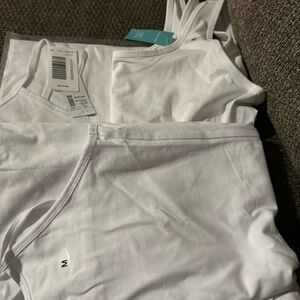 3 medium white tank tops super cute from Maurice’s brand new